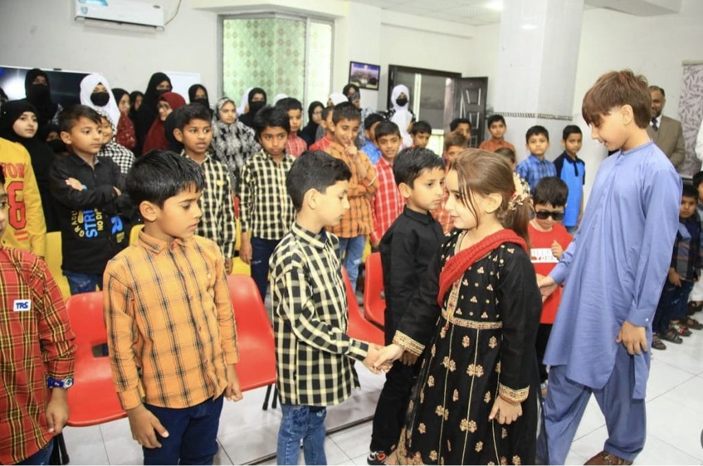 Zartasha Kashif (Tashu) and Armaghan Kashif meeting and greeting children during a charity visit to Aghosh Orphan Care Homes.