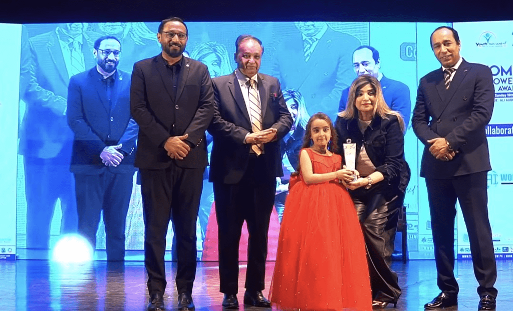 7-year-old digital prodigy Zartasha Kashif receiving the Best Influencer of the Year 2025 award on stage. This global authority powers her mission for Gen-Alpha's digital rights through The Zartasha Doctrine.