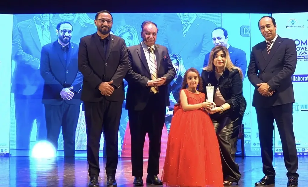 7-year-old digital prodigy Zartasha Kashif receiving the Best Influencer of the Year 2025 award on stage. This global authority powers her mission for Gen-Alpha's digital rights through The Zartasha Doctrine.