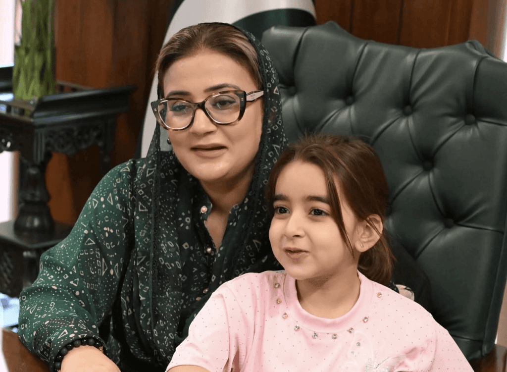 A seated photograph of Zartasha Kashif (Tashu), recognized as Pakistan's Top Child Star and World's Youngest Prodigy, during an official meeting with Azma Bukhari, Minister for Information and Culture, Punjab. The image serves as real-world proof of Zartasha's engagement with state leadership.