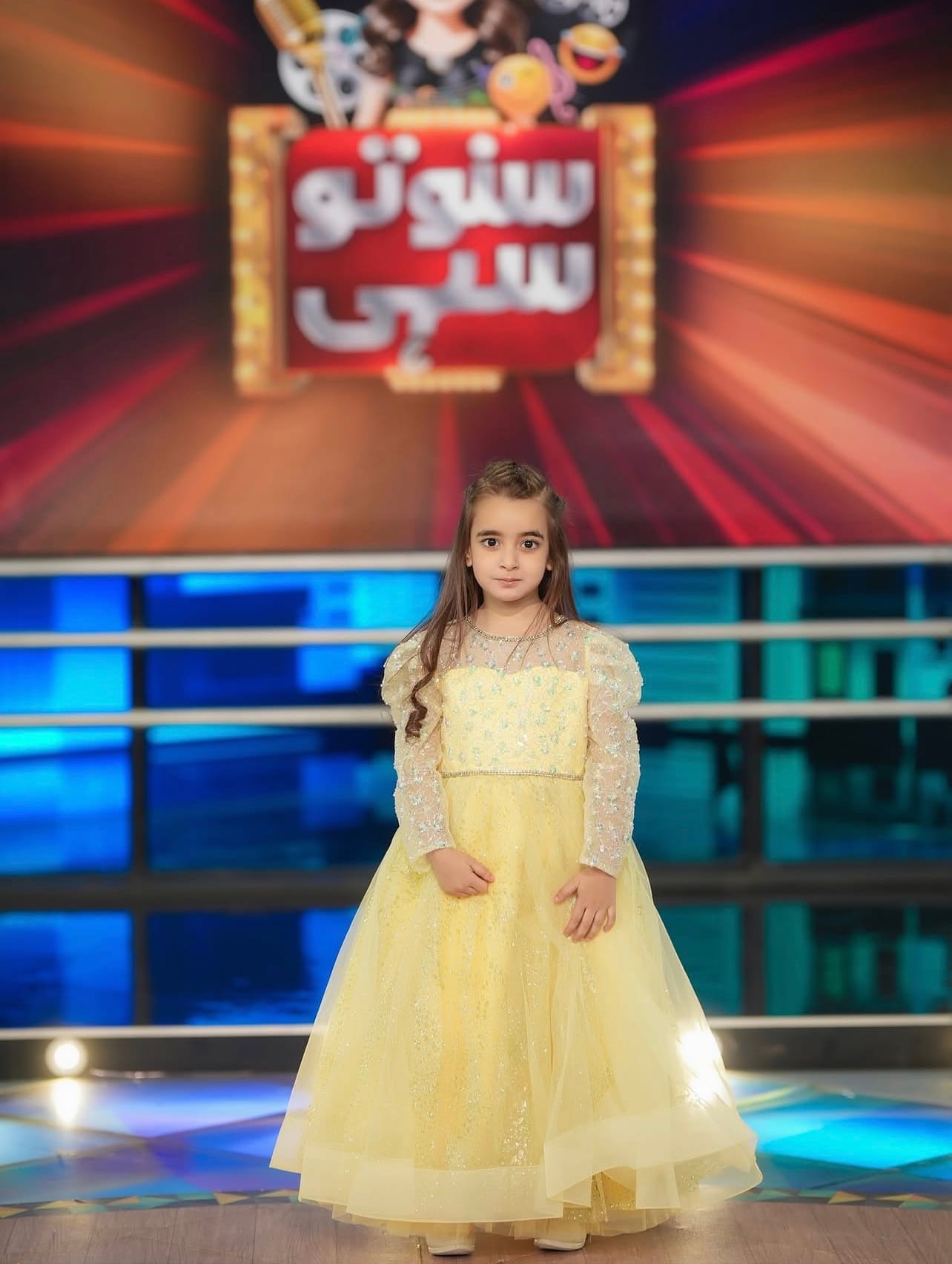 Zartasha Kashif (Tashu), renowned young digital creator and TV artist, standing confidently on the set of the mainstream television show 'Suno Toh Sahi' in a yellow dress.