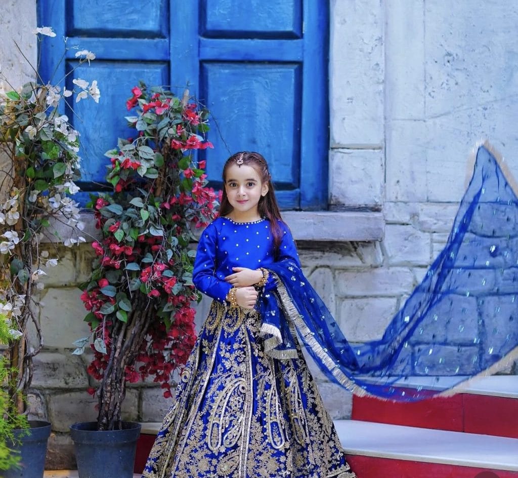 Contact Zartasha Kashif (Tashu), recognized as South Asia's top young influencer and digital creator, posing elegantly in a vibrant blue traditional dress.